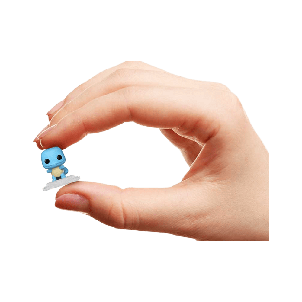 Person holding a miniature Funko Bitty Pop: Pokemon - Squirtle 4pk figure in hand